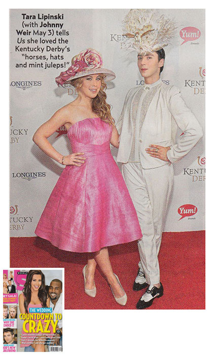Magazine page of a woman in a pink dress, and a man in a white suit