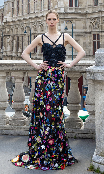 Woman in a black and multicolored floral gown