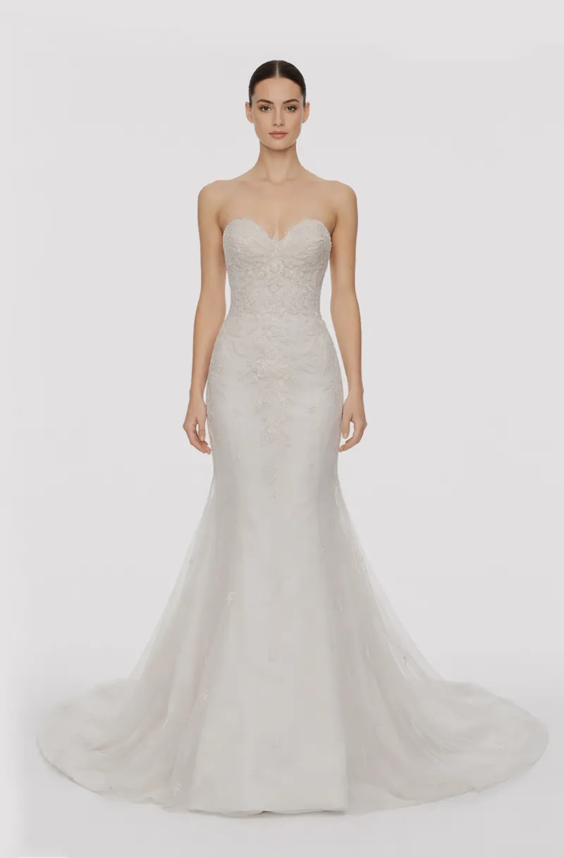 Front view of a woman in an Off-white French lace sweetheart mermaid gown with hand-beaded applique bodice 12, image 1