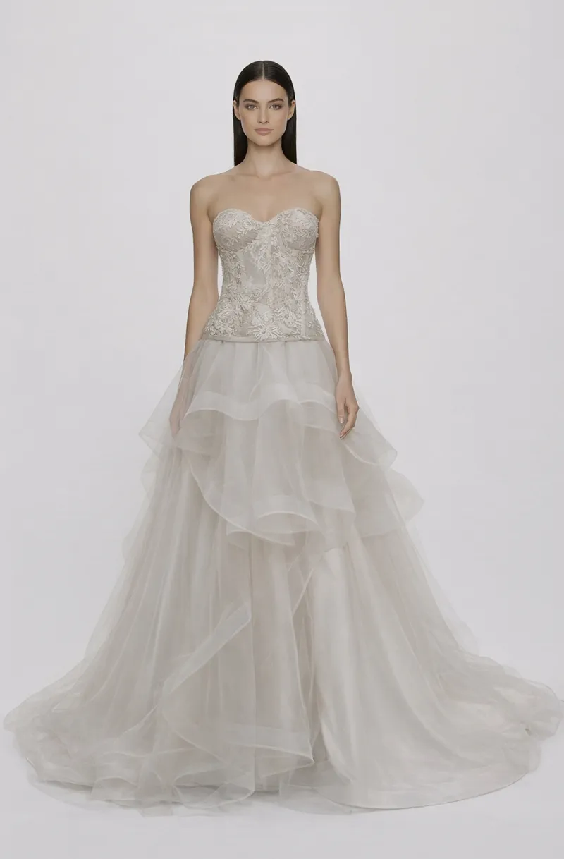 Front view of a woman in an Off-white tulle two-piece ensemble with French lace corset featuring lace applique and an asymmetrical skirt with horsehair 23, image 1