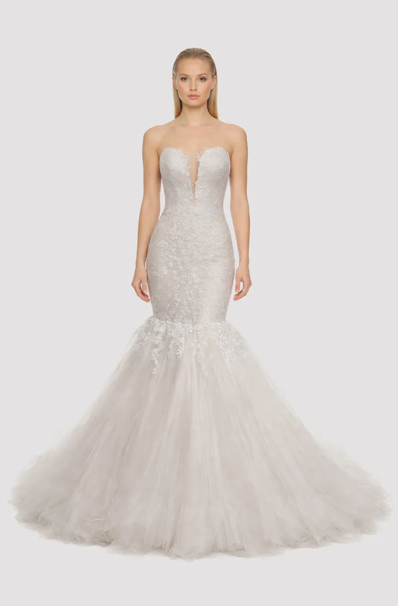Front view of a woman in an Off-white tulle deep neck mermaid gown with French lace bodice and cascading lace applique 24, image 1