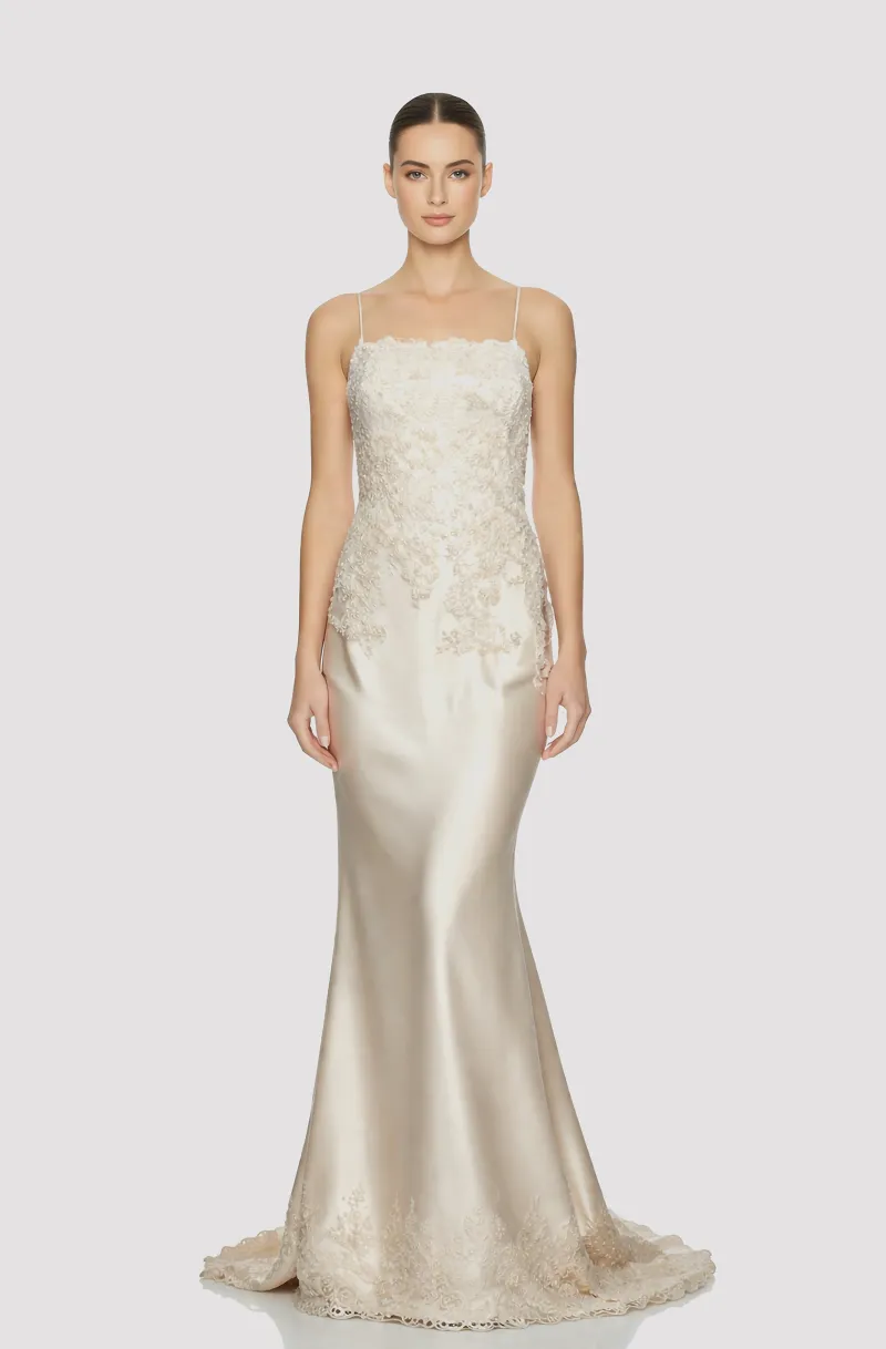 Front view of a woman in an Off-white Thai silk mermaid gown embellished with hand-beaded lace bodice and hemline 4, image 1