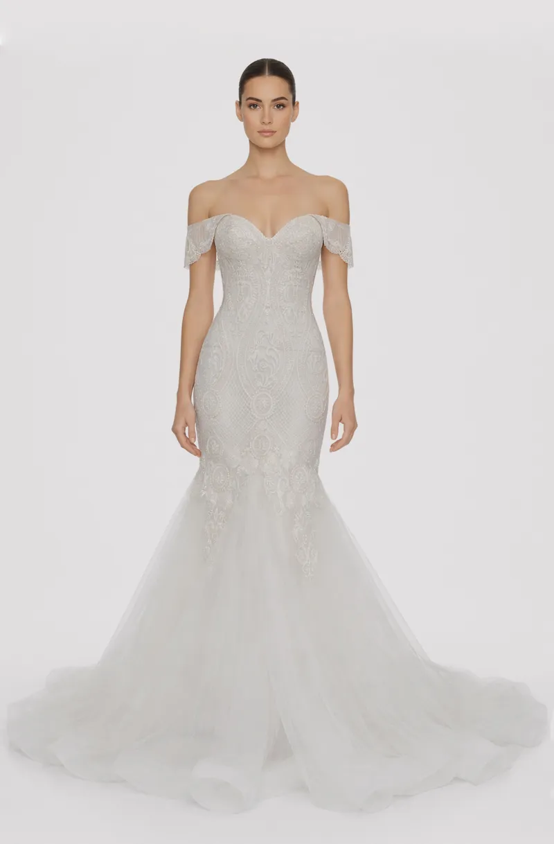 Front view of a woman in an Off-white tulle off-shoulder sleeved mermaid gown embellished with hand-beaded lace 8, image 1
