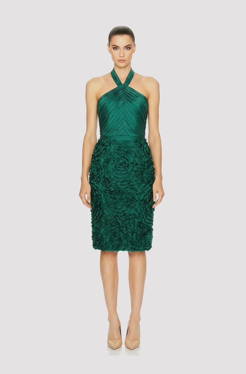 Front view of a woman in an Emerald green mikado halter dress with a pleated bodice and 3D floral skirt 1, image 1