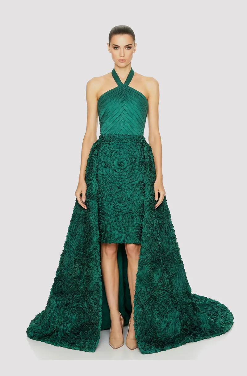 Front view of a woman in an Emerald green mikado halter couture dress with a pleated bodice and 3D floral skirt and detachable train 2, image 1