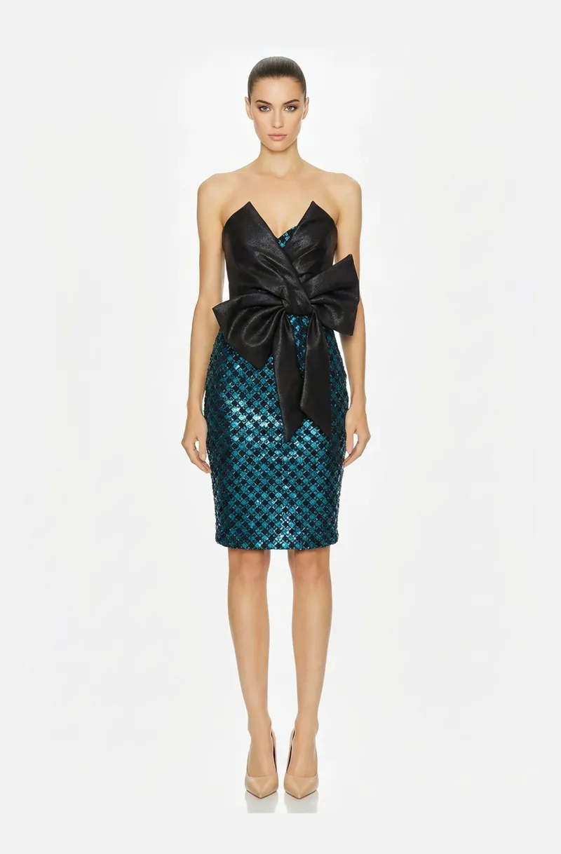 Front view of a woman in a Black Mikado draped cocktail dress with turquoise & black lame skirt, accented with side bow 22, image 1