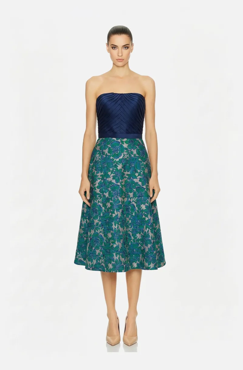 Front view of a woman in a Navy blue draped mikado bodice dress with green floral print brocade skirt 26, image 1