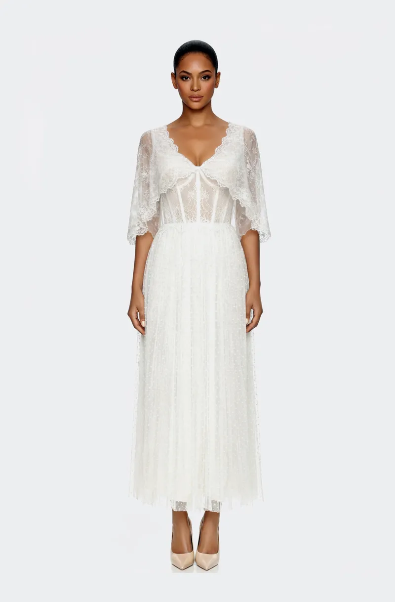 Front view of a woman in an Off-white midi dress with corseted French lace top and dotted Swiss organza electric-pleated skirt with capelet 40, image 1