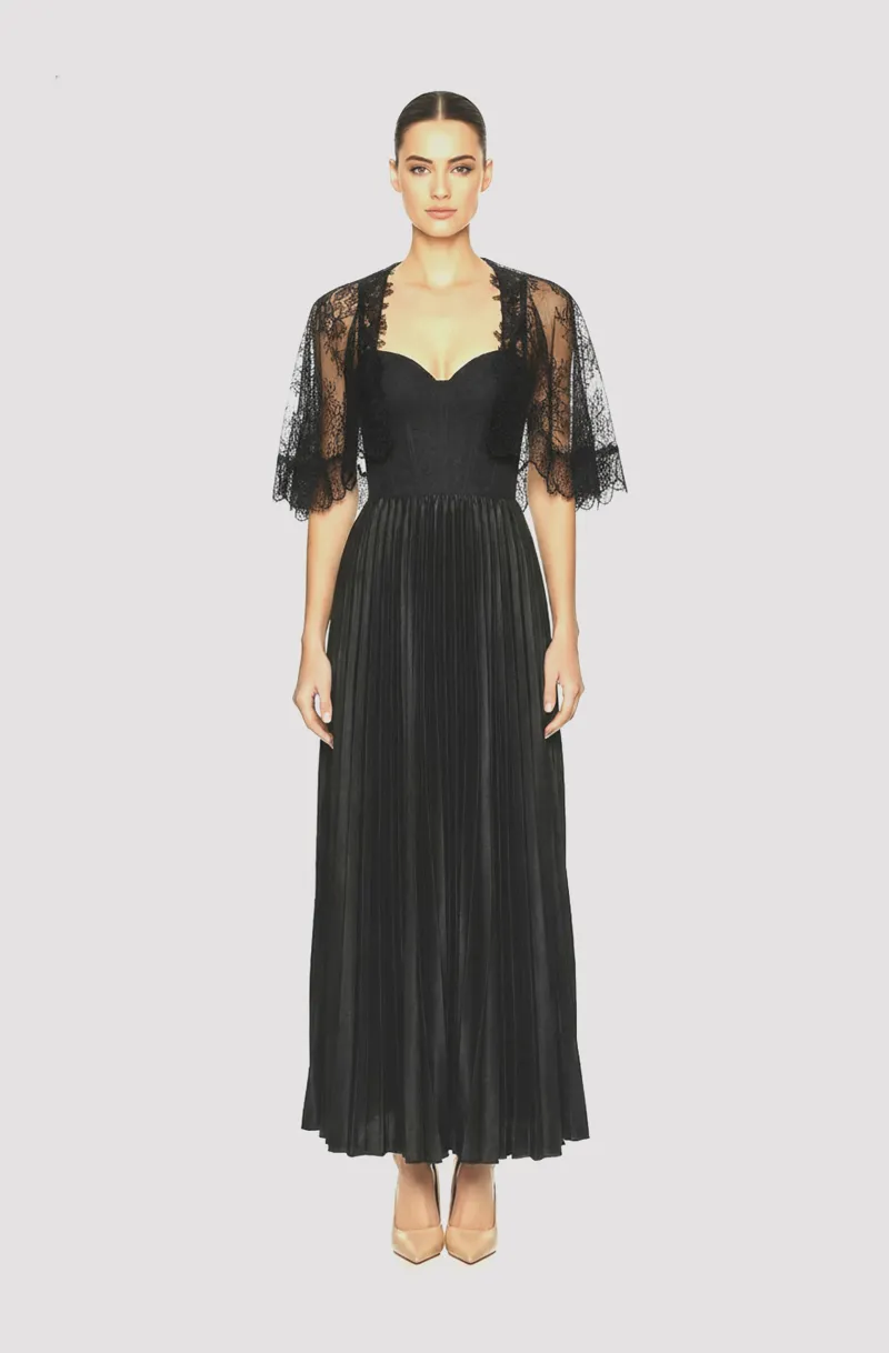 Front view of a woman in a Black satin electric-pleated midi cocktail dress with beaded straps and French lace corseted top and French lace capelet 65, image 1