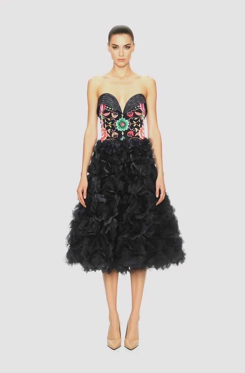 Front view of a woman in a Black corseted organza midi couture ball dress with hand-embroidered bodice and 3D floral appliqués 67, image 1