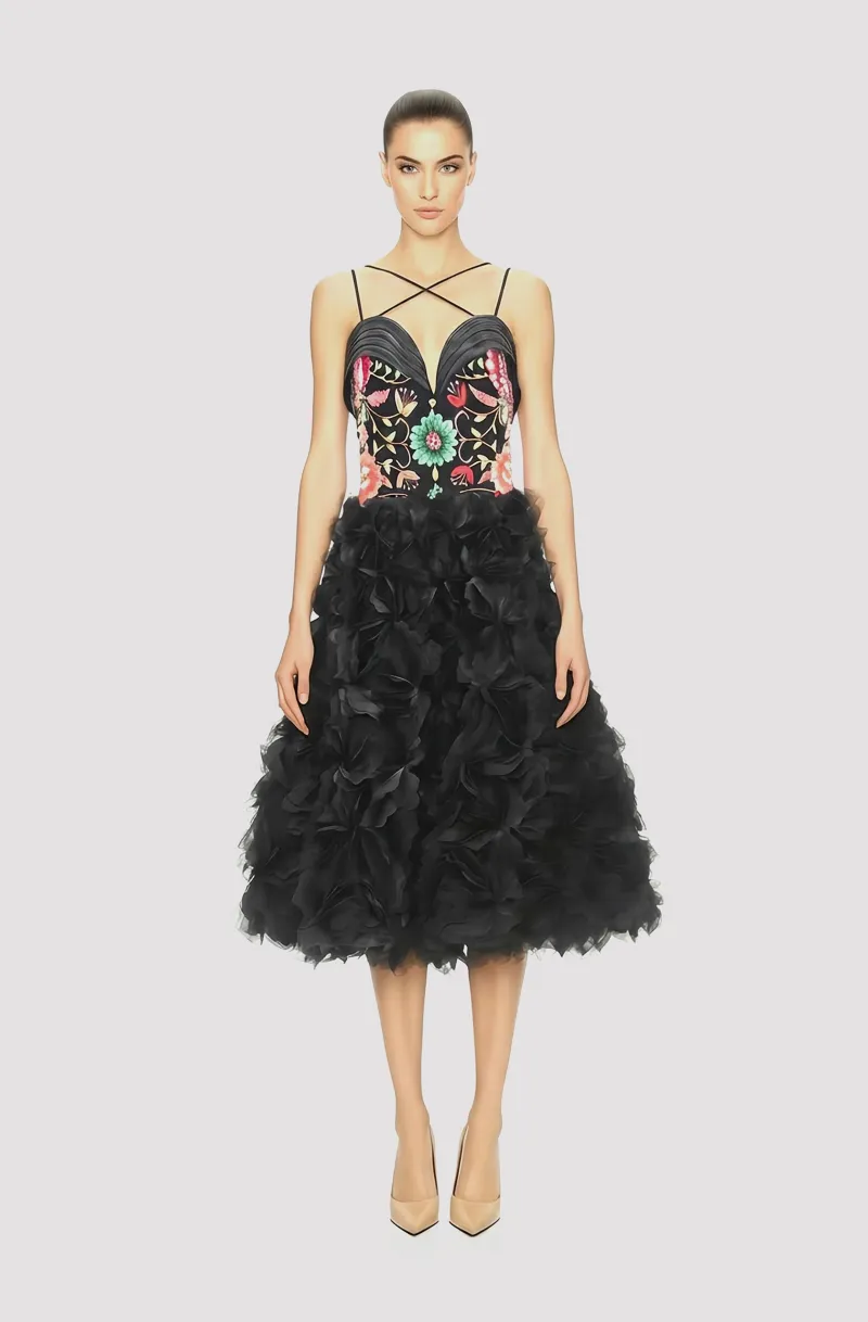 Front view of a woman in a Black corseted organza midi couture ball dress with hand-embroidered bodice and 3D floral appliqués, with detachable spaghetti straps 68, image 1