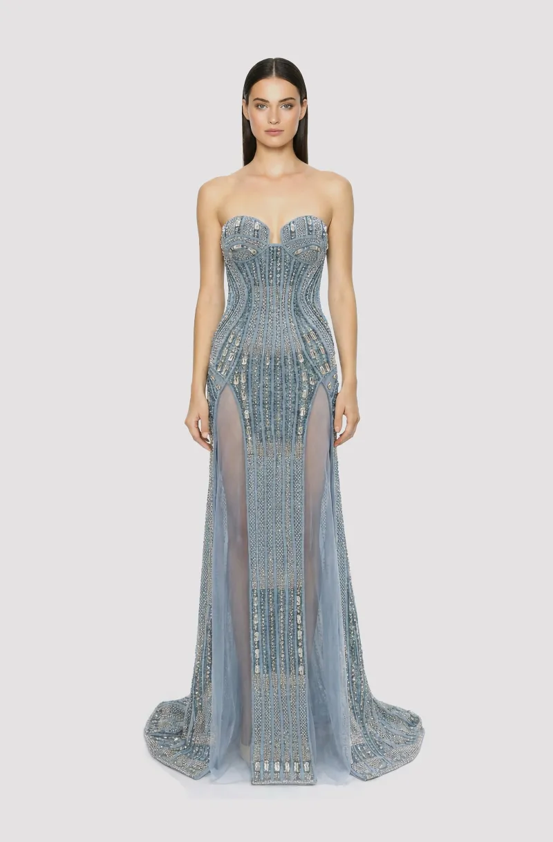 Front view of a woman in a Blue corseted couture hand-beaded mermaid gown with see-through side slits 28, image 1