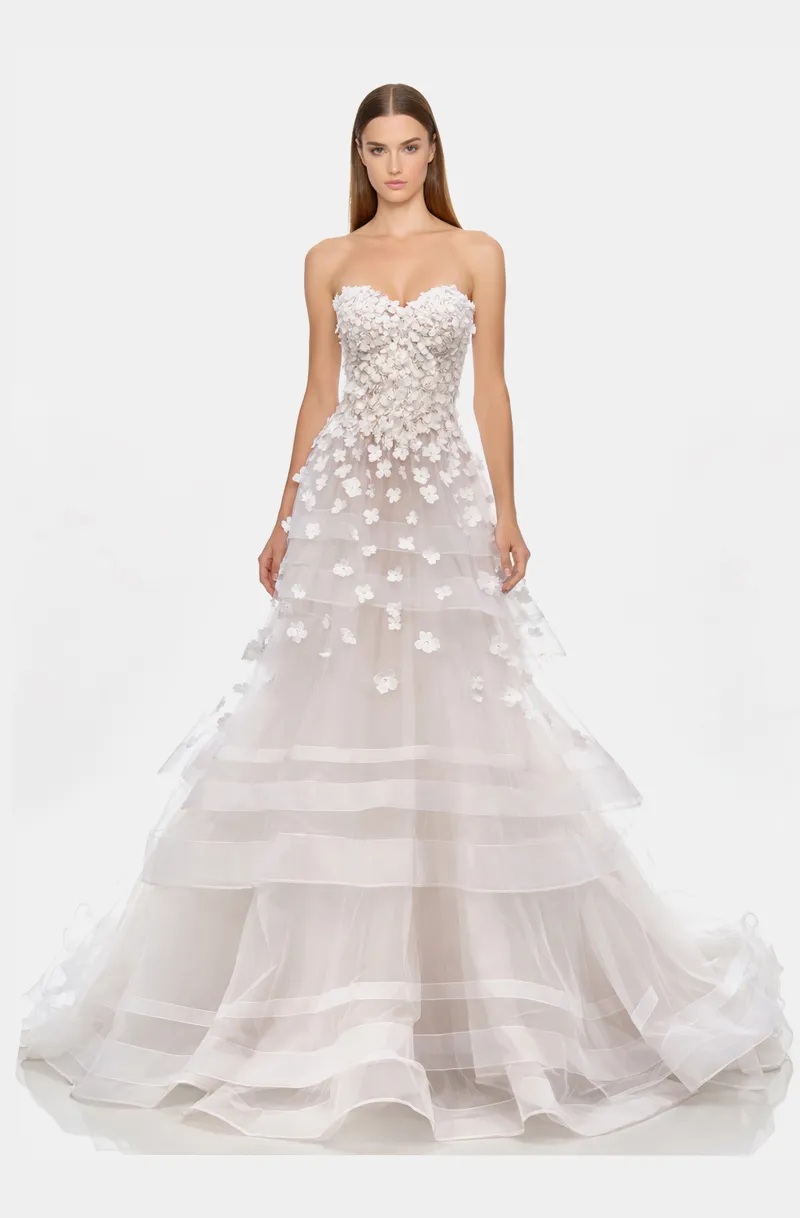 Front view of a woman in an Off-white tulle, layered horsehair ball gown with hand-sewn 3D floral embellishments 43, image 1