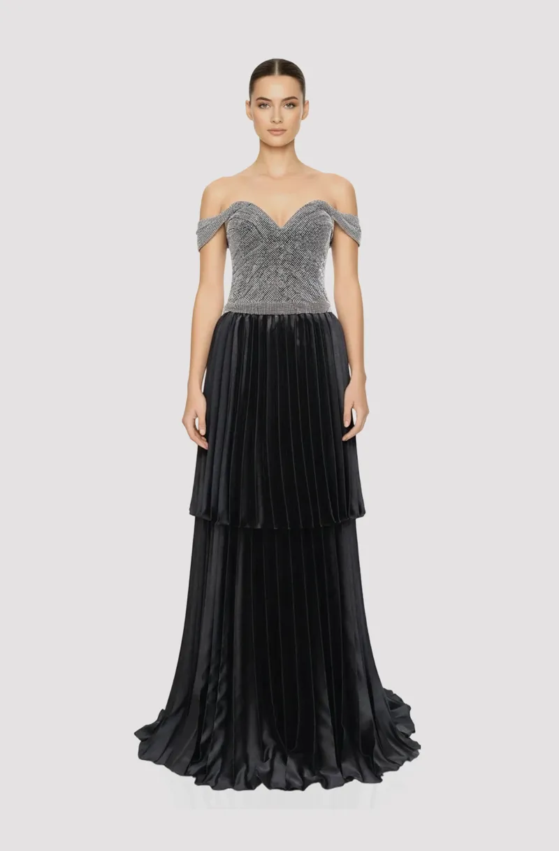 Front view of a woman in a Silver & black gown with chainmail corseted off-shoulder, drop-waist top, with two-tiered black satin electric pleated skirt 48, image 1