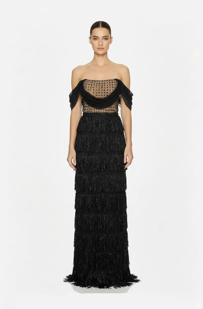 Front view of a woman in a Black off-shoulder column gown with mesh & rhinestone top and skirt with fringes 50, image 1