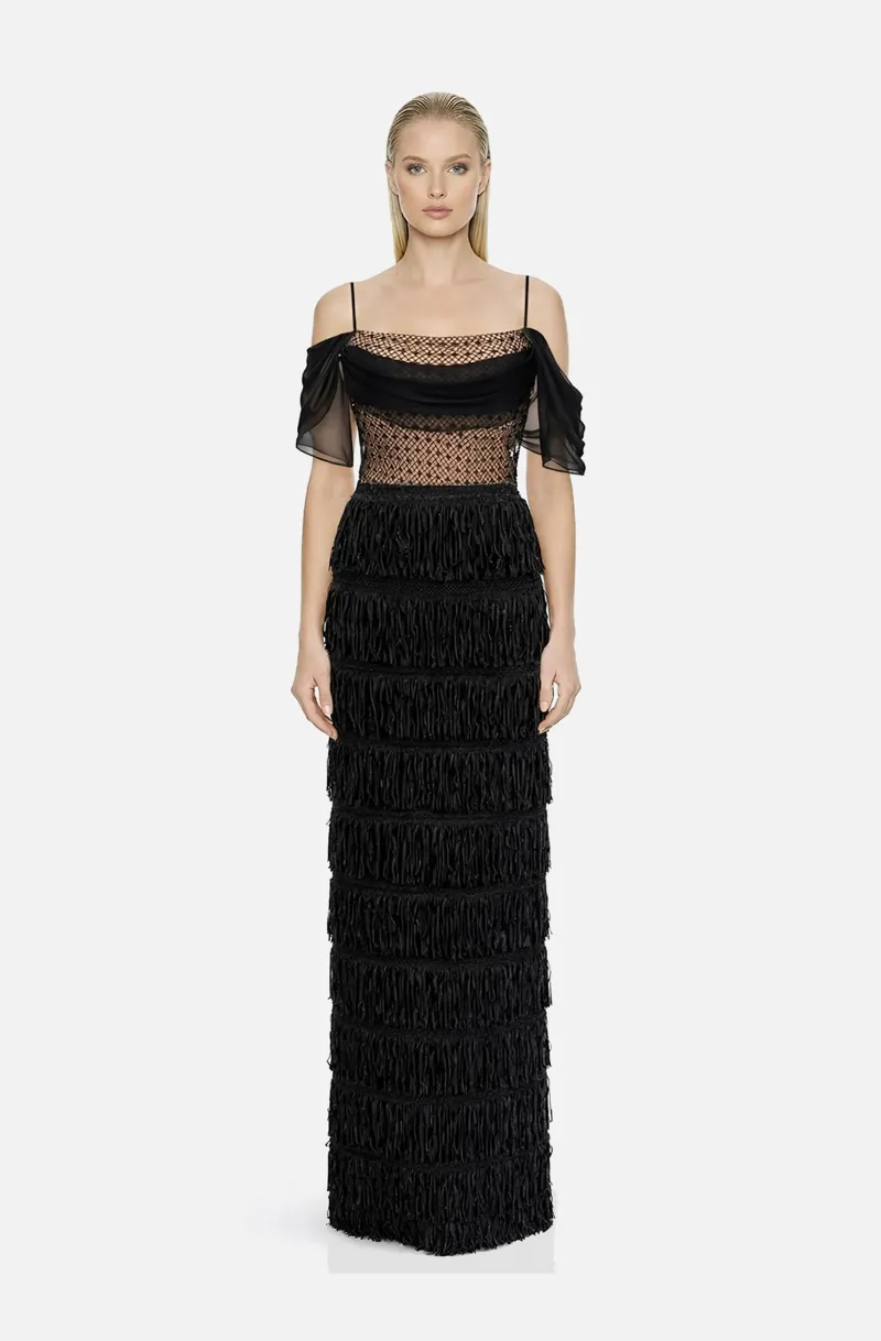 Front view of a woman in a Black off-shoulder column gown with nude corset featuring draped mesh with black crystals and a layered fringe skirt 51, image 1