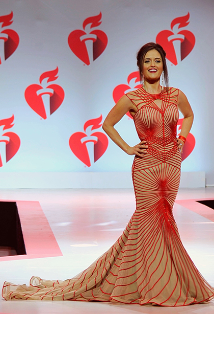 Woman in a beige with red strips gown