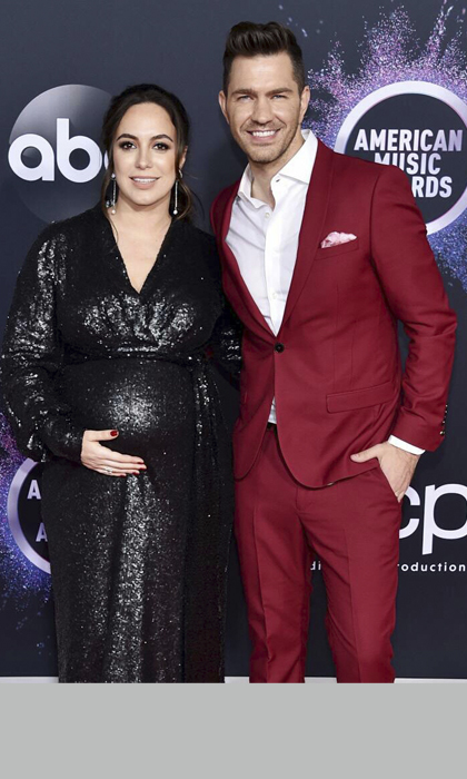 Woman in a black gown and man in a red suit